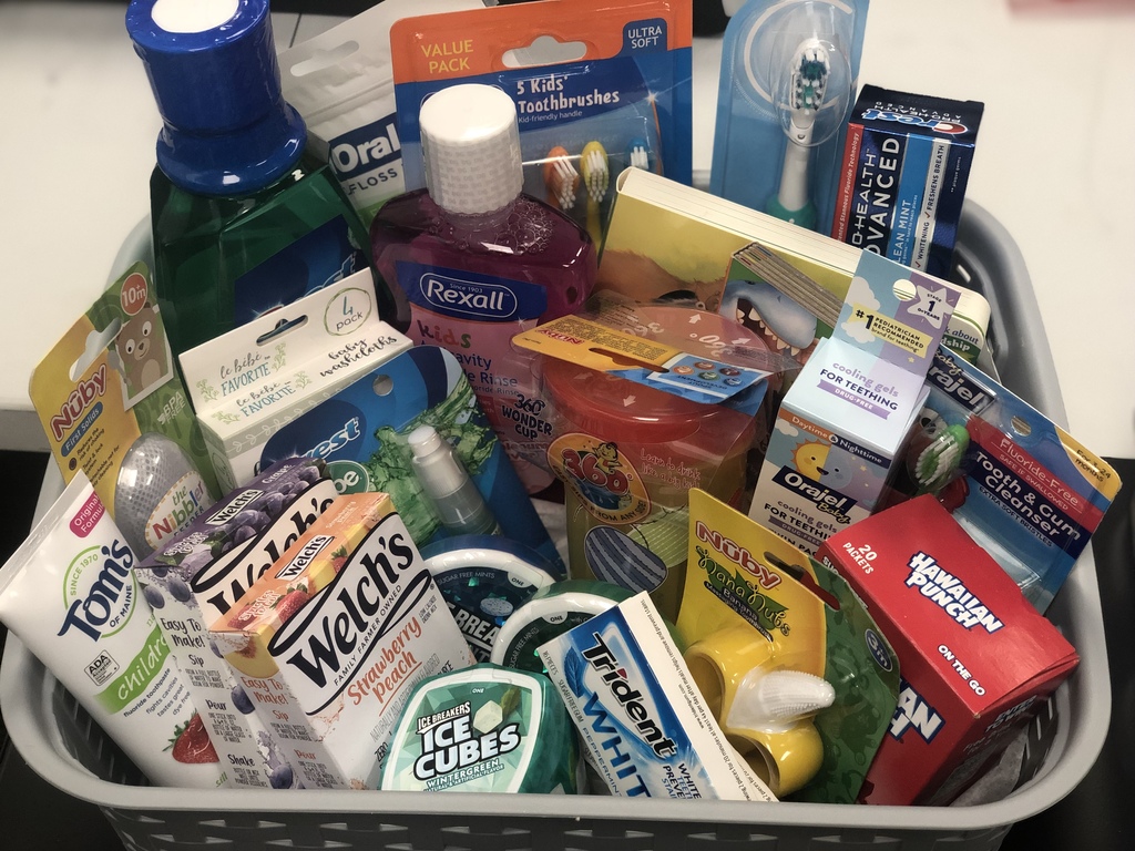 Picture of a dental raffle basket. Includes things like mouth wash, toothbrushes, tooth paste, sugar free gum, baby teethers, etc.